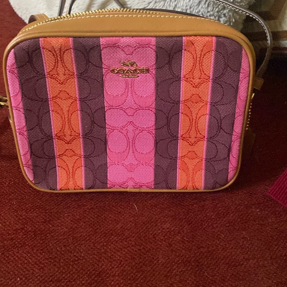 Small camera crossbody bag by coach only worn once